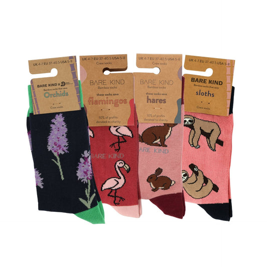 Set of four pairs of socks with animal illustrations and 'Bare Kind' branding on packaging.