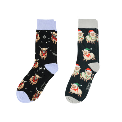 Two pairs of socks with festive animal patterns on a white background