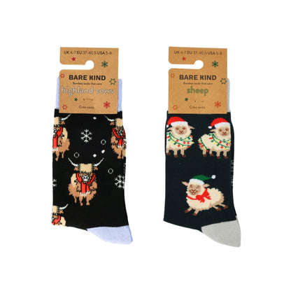 Two pairs of Christmas-themed socks with highland cows and sheep on a white background.