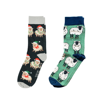 Two pairs of socks with sheep designs on a white background