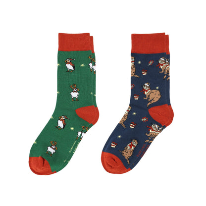 Two pairs of socks, one green and one blue, with animal patterns on a white background.