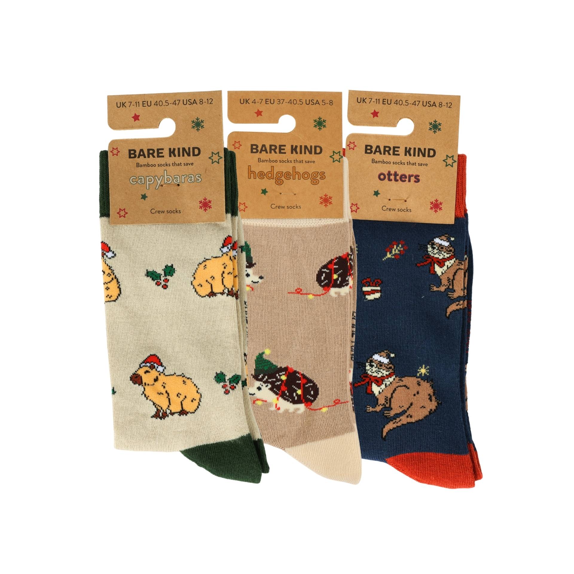 Three pairs of socks with animal designs on packaging labeled 'Bare Kind'.