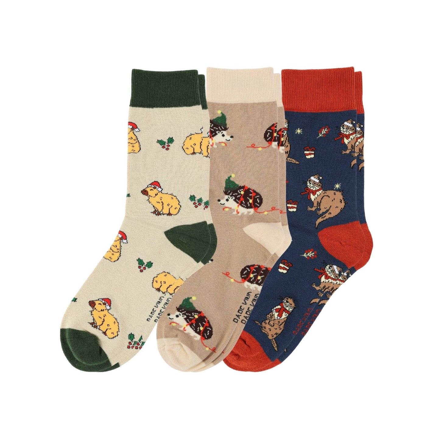 Three pairs of socks with dog patterns on a white background