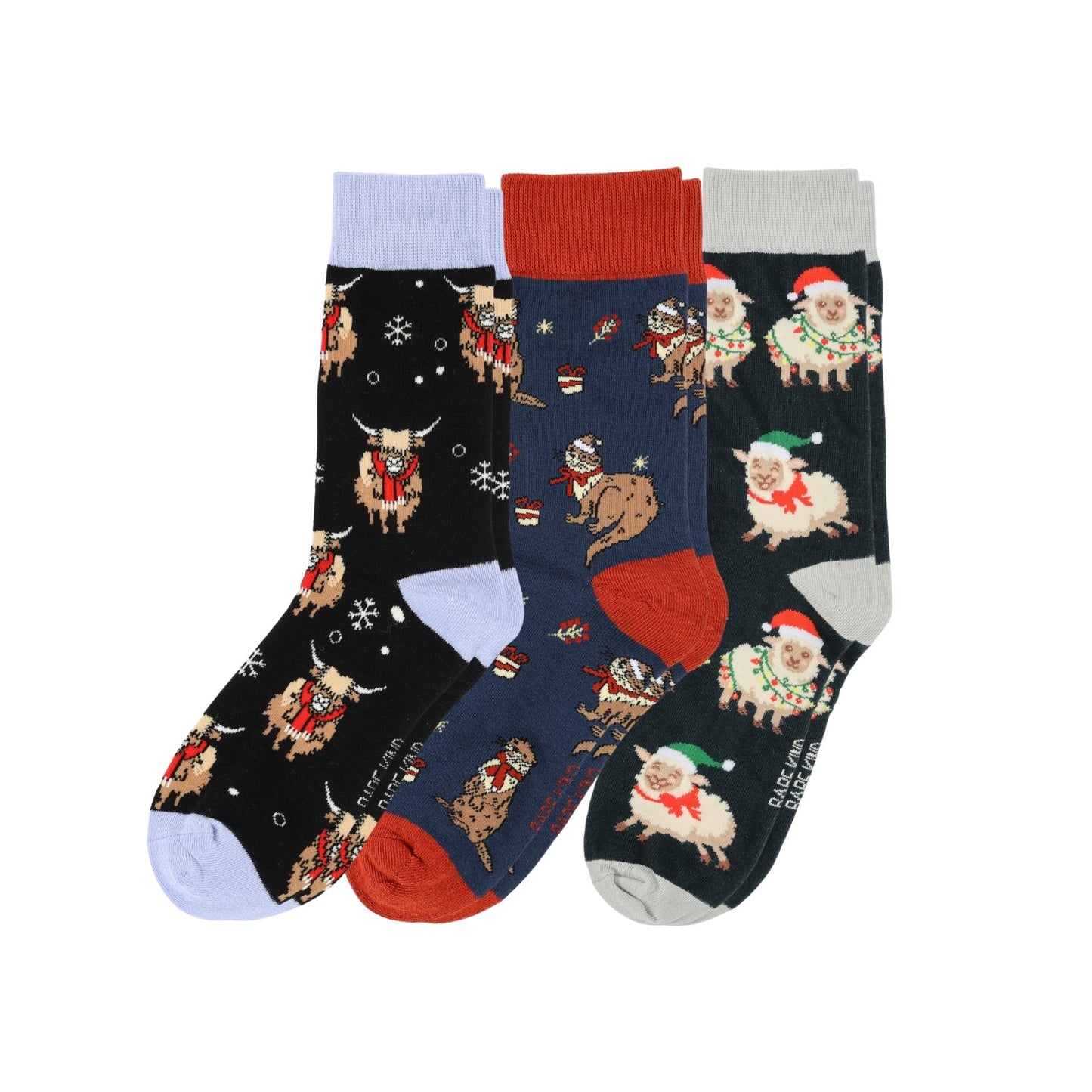 Three pairs of Christmas-themed socks with different patterns on a white background.