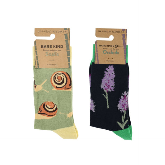 Two pairs of socks with snail and orchid designs in their packaging on a white background.