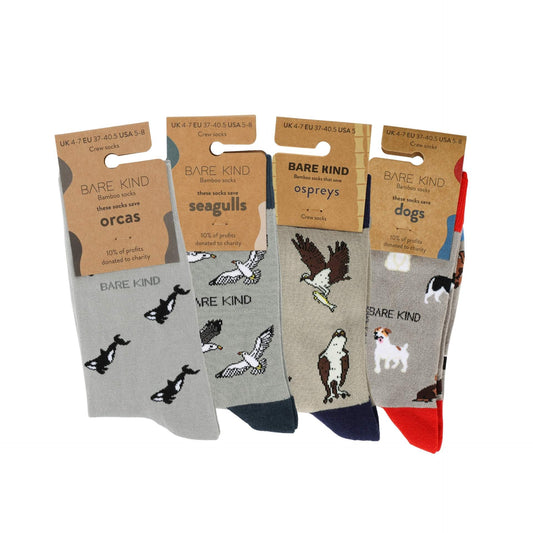 Four pairs of socks with animal illustrations and 'Bare Kind' packaging on a white background
