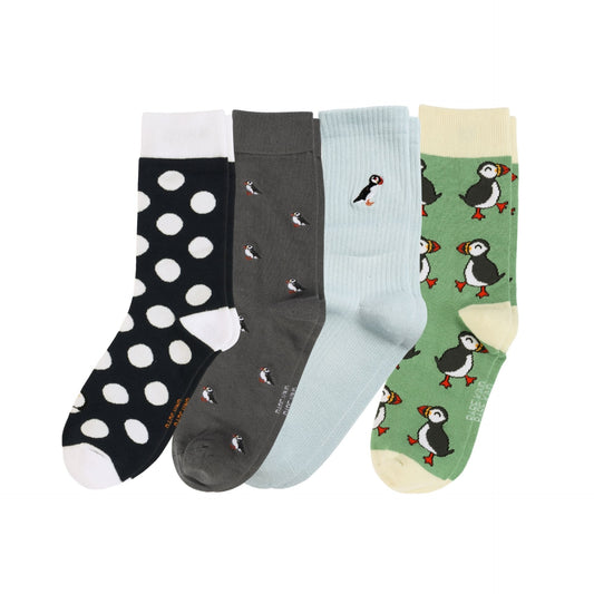 Four pairs of socks with different patterns on a white background
