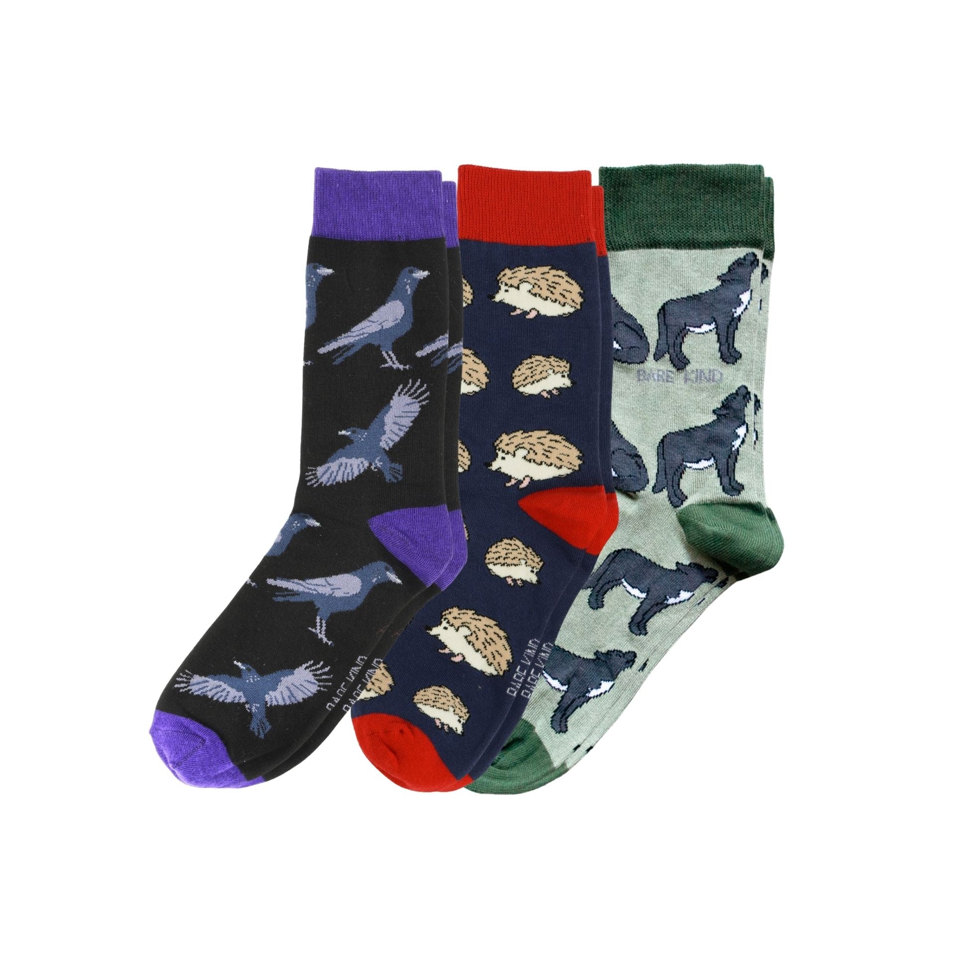 Three pairs of socks with animal patterns on a white background