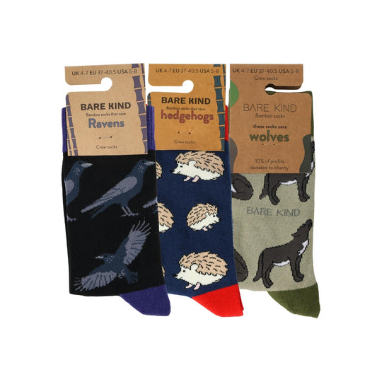 Three pairs of socks with animal patterns and 'Bare Kind' packaging on a white background.