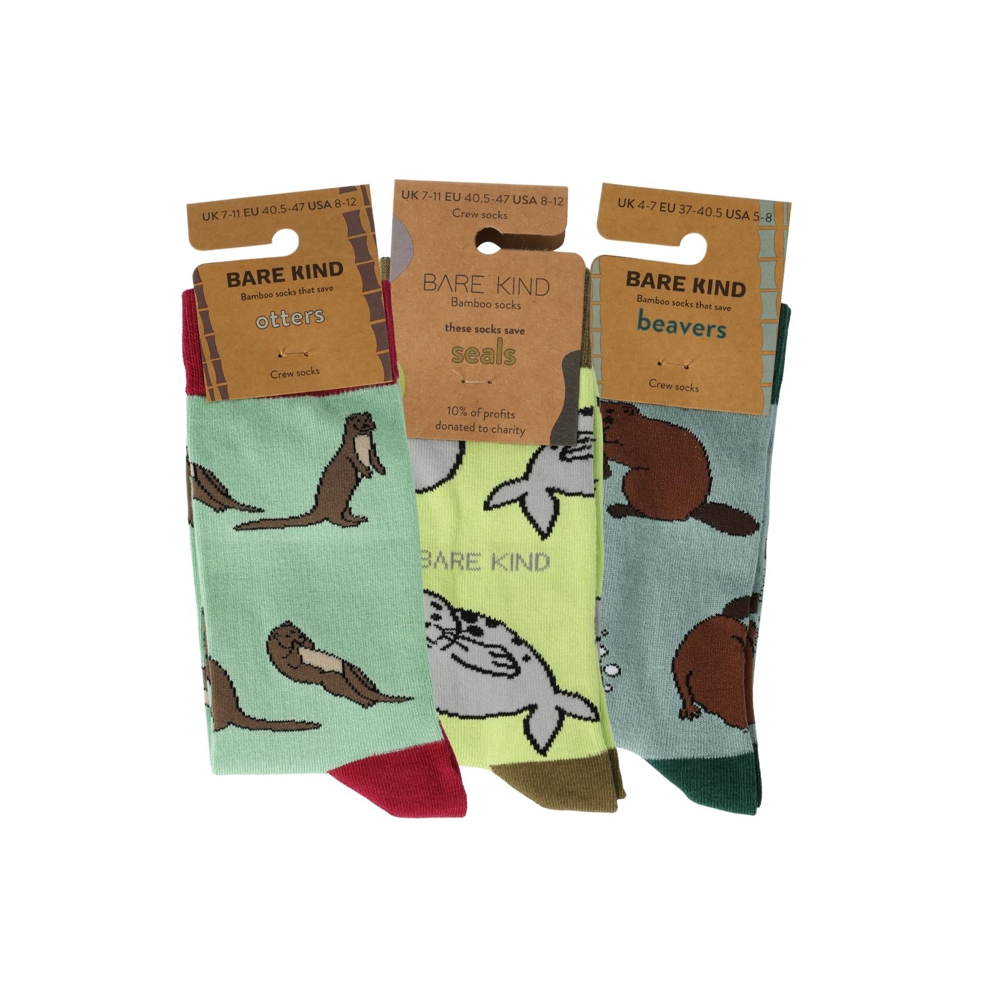 Set of three pairs of socks with animal designs on a white background