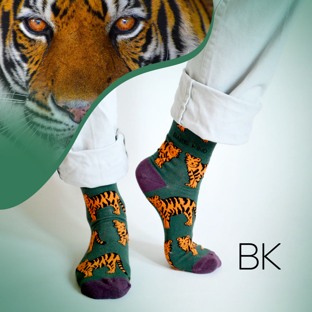 standing model wearing green bamboo tiger socks with tiger image