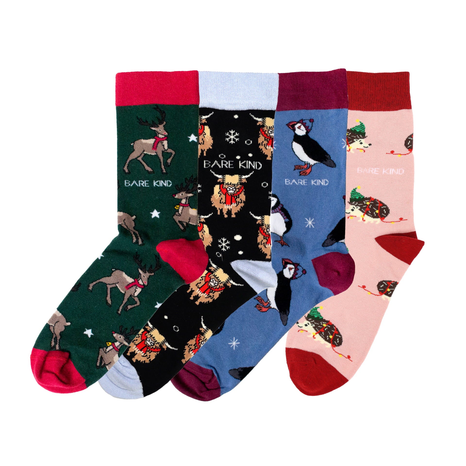 flat lay image of christmas reindeer, christmas highland cow, christmas hedgehog and christmas puffin bamboo socks bundle