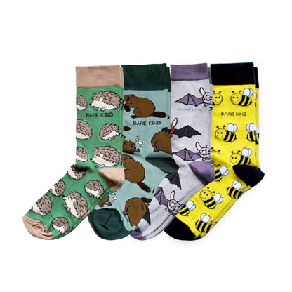 Set of four pairs of socks with animal patterns on a white background