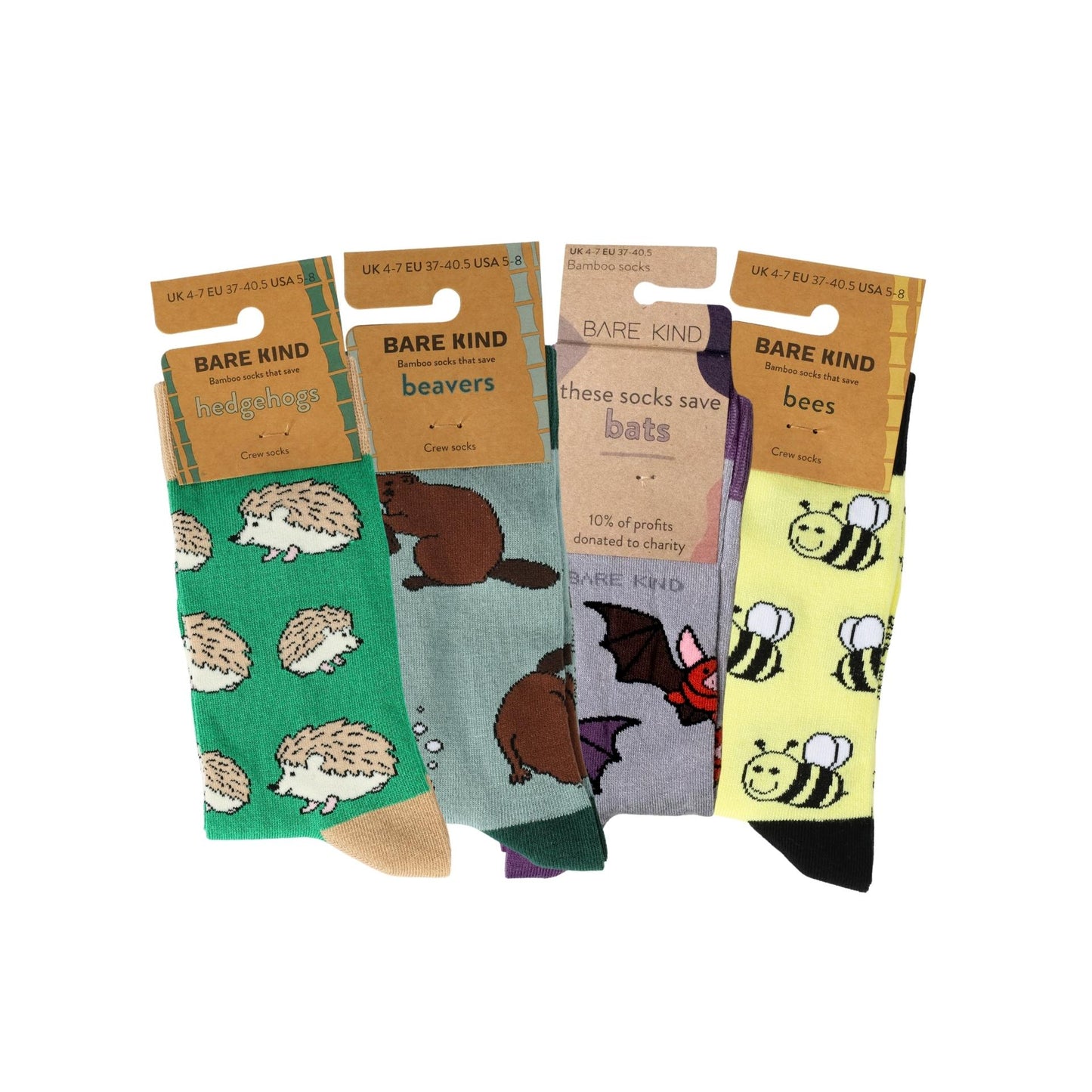 Set of four pairs of socks with animal patterns on a white background