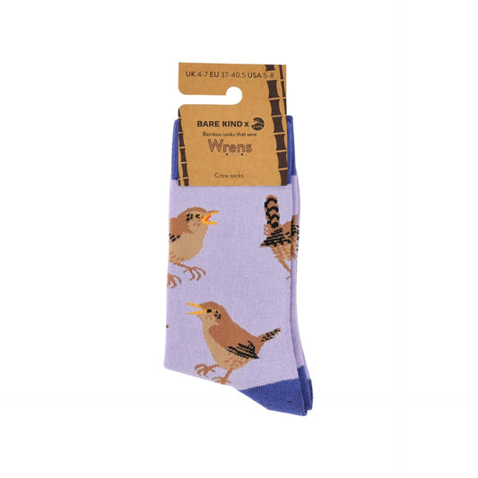 A pair of crew socks in light purple with a bird pattern, on a brown cardboard hanger against a white background.
