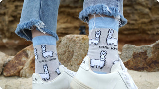 model wearing grey blue alpaca bamboo socks