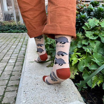 model wearing beige badger bamboo socks