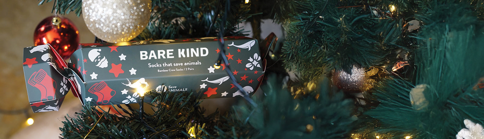 Bare Kind chocolate bars on a Christmas tree with ornaments.