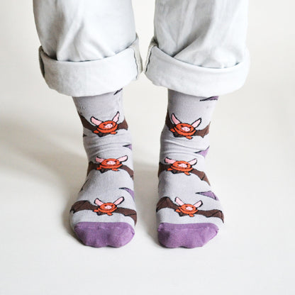 model wearing grey purple bats bamboo socks