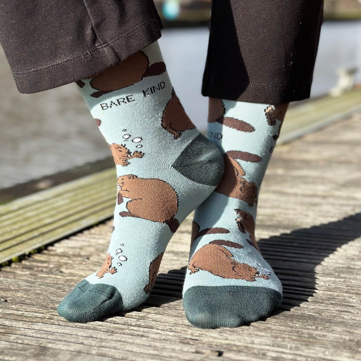 model wearing green beaver bamboo socks