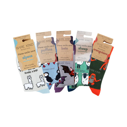 packaging of grey blue alpaca, blue puffin, grey bats, green sheep, green orange orangutan bamboo socks