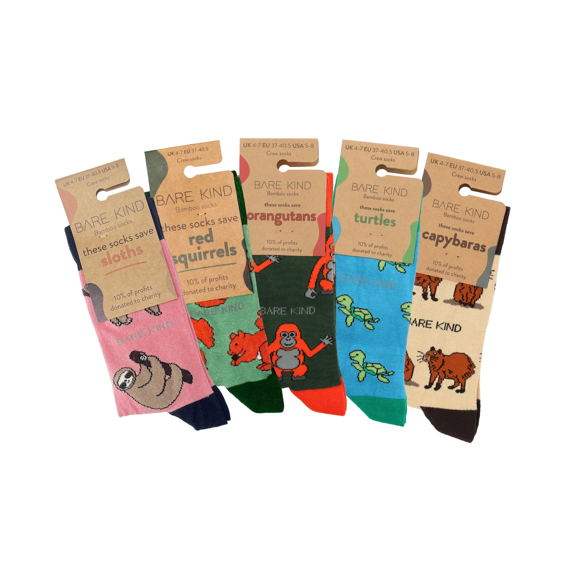 packaging flat lays of pink sloth, green red squirrel, green orangutan, blue turtle, cream capybara bamboo socks