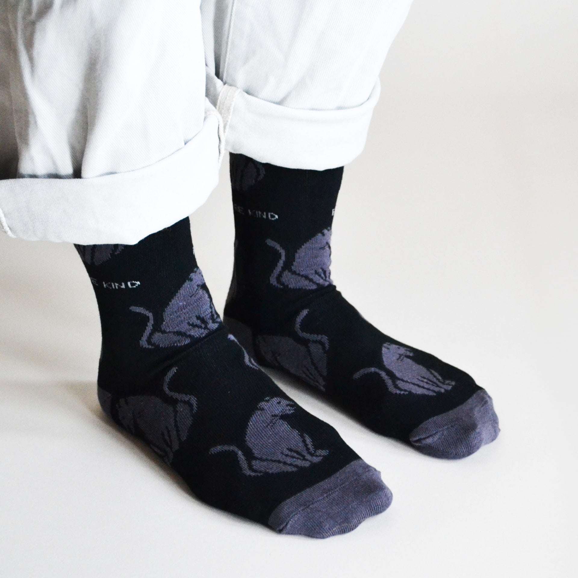 side angle view of model wearing black panther bamboo socks 