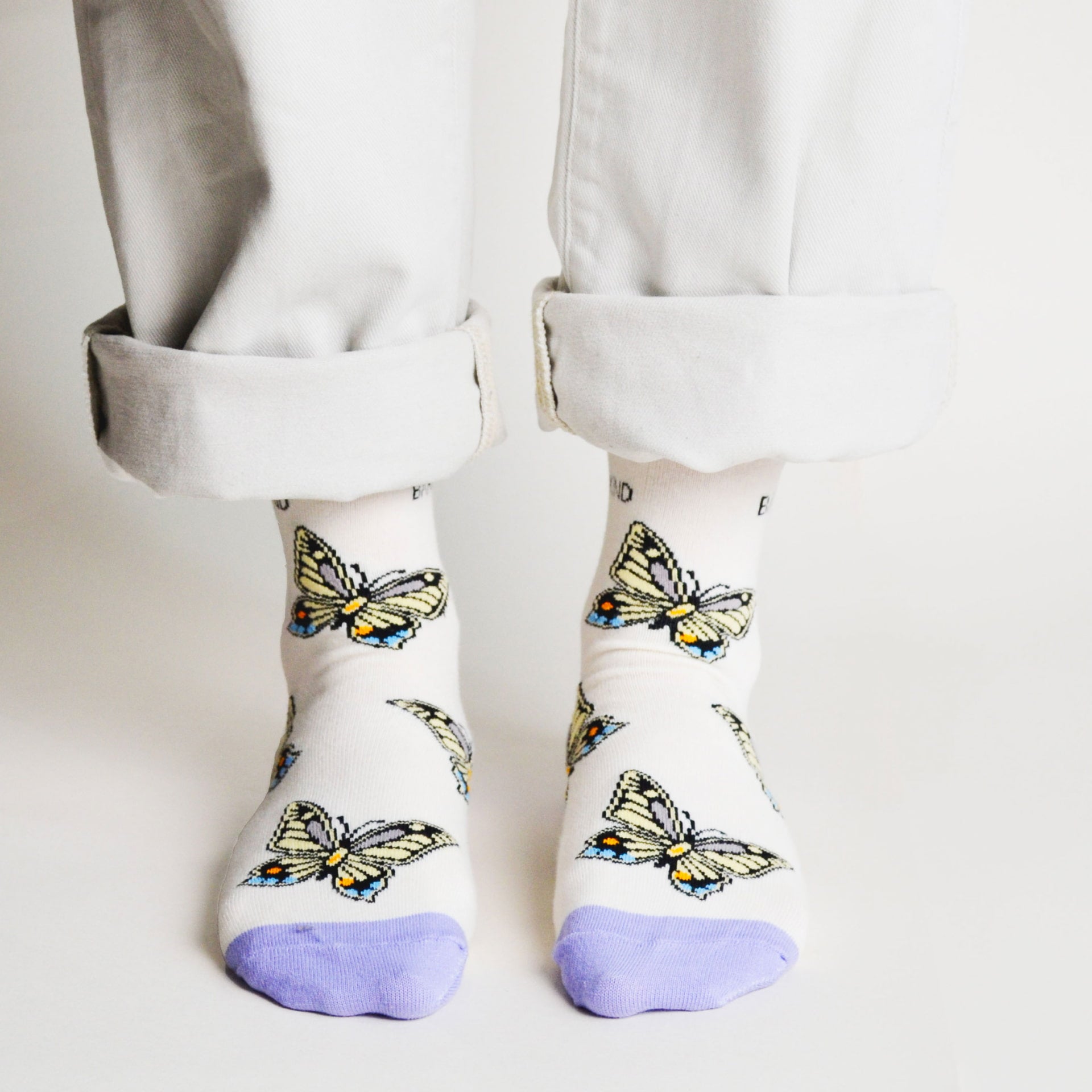 front view of standing model wearing butterfly bamboo socks