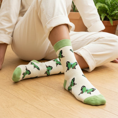 Model wearing green butterfly socks