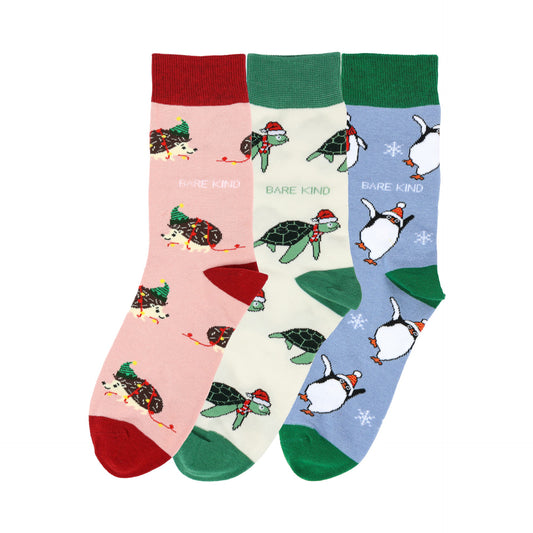 flat lays of christmas hedgehog, turtle and penguin bamboo socks