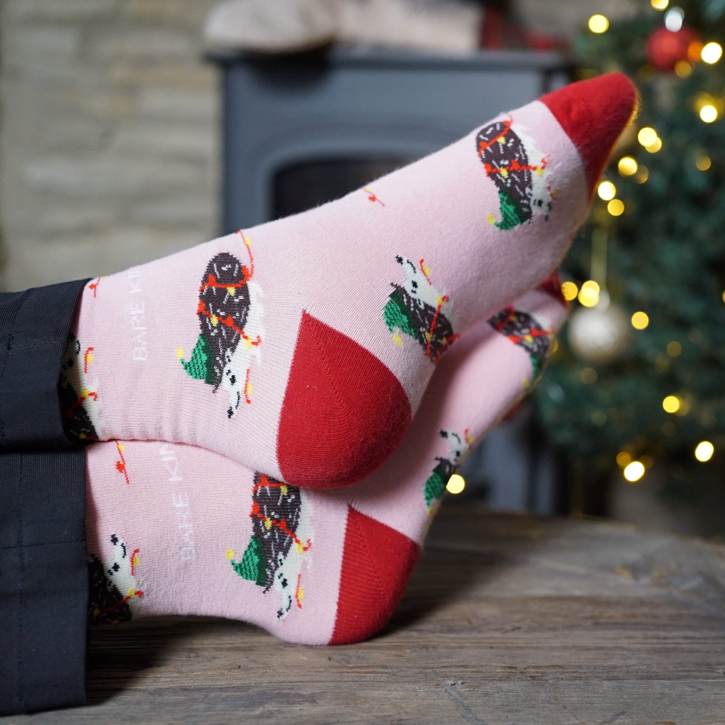 model wearing pink christmas hedgehog bamboo socks