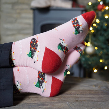 model wearing pink christmas hedgehog bamboo socks