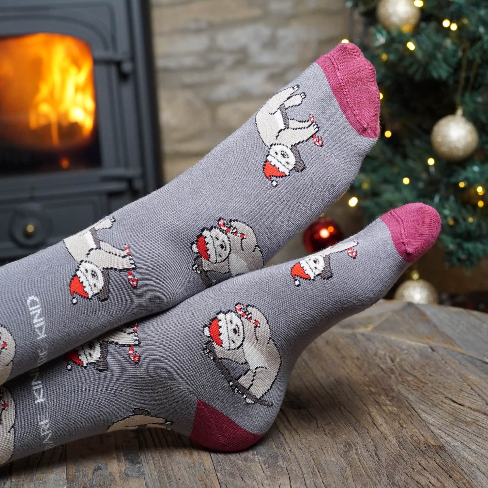 lifestyle image of grey christmas sloth bamboo socks