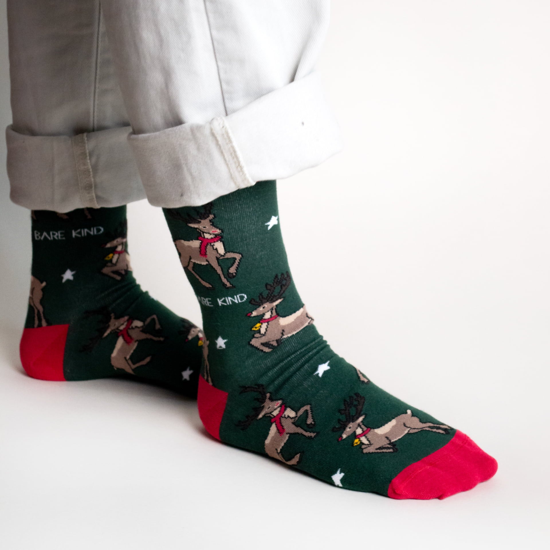 model wearing green christmas reindeer bamboo socks