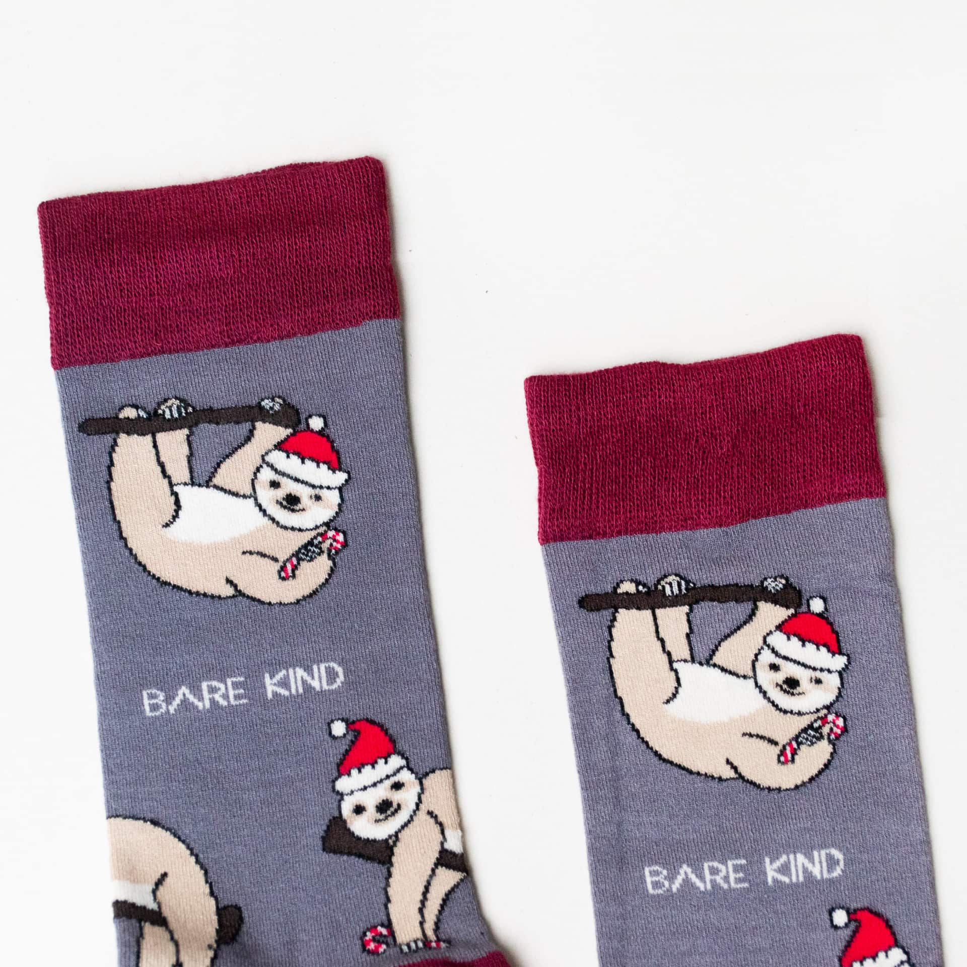 closeup to grey red christmas sloth bamboo socks