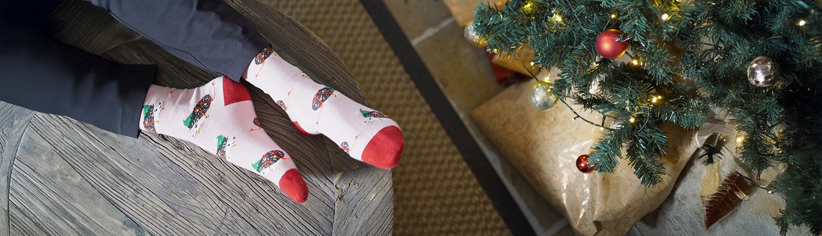 Person wearing festive socks with hedgehogs design 