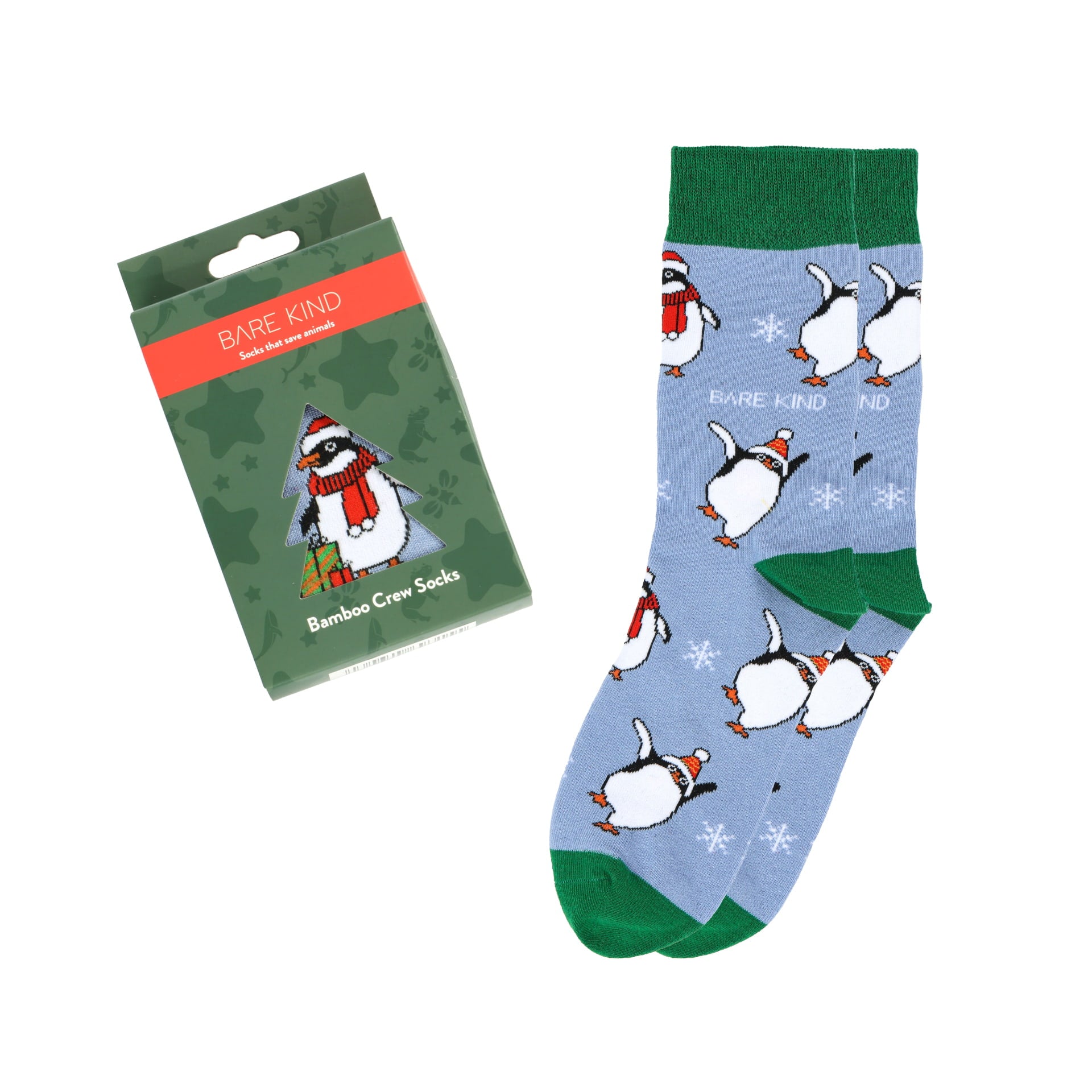 flat lay of bauble with christmas penguin bamboo socks