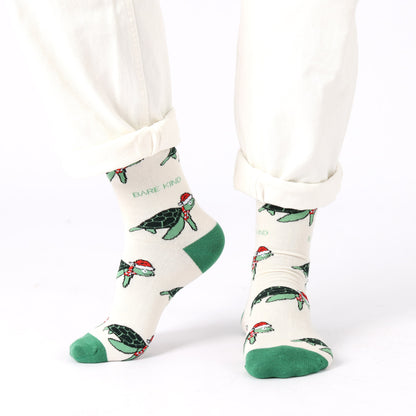 model wearing cream green Christmas turtle bamboo socks