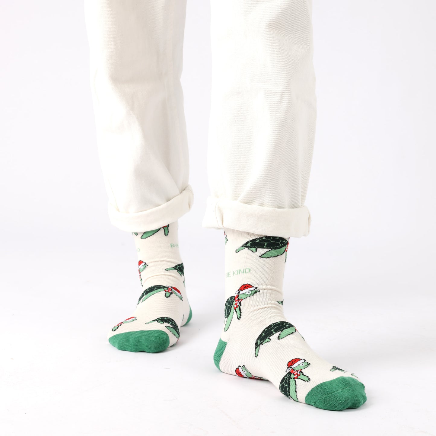 model wearing cream green Christmas turtle bamboo socks