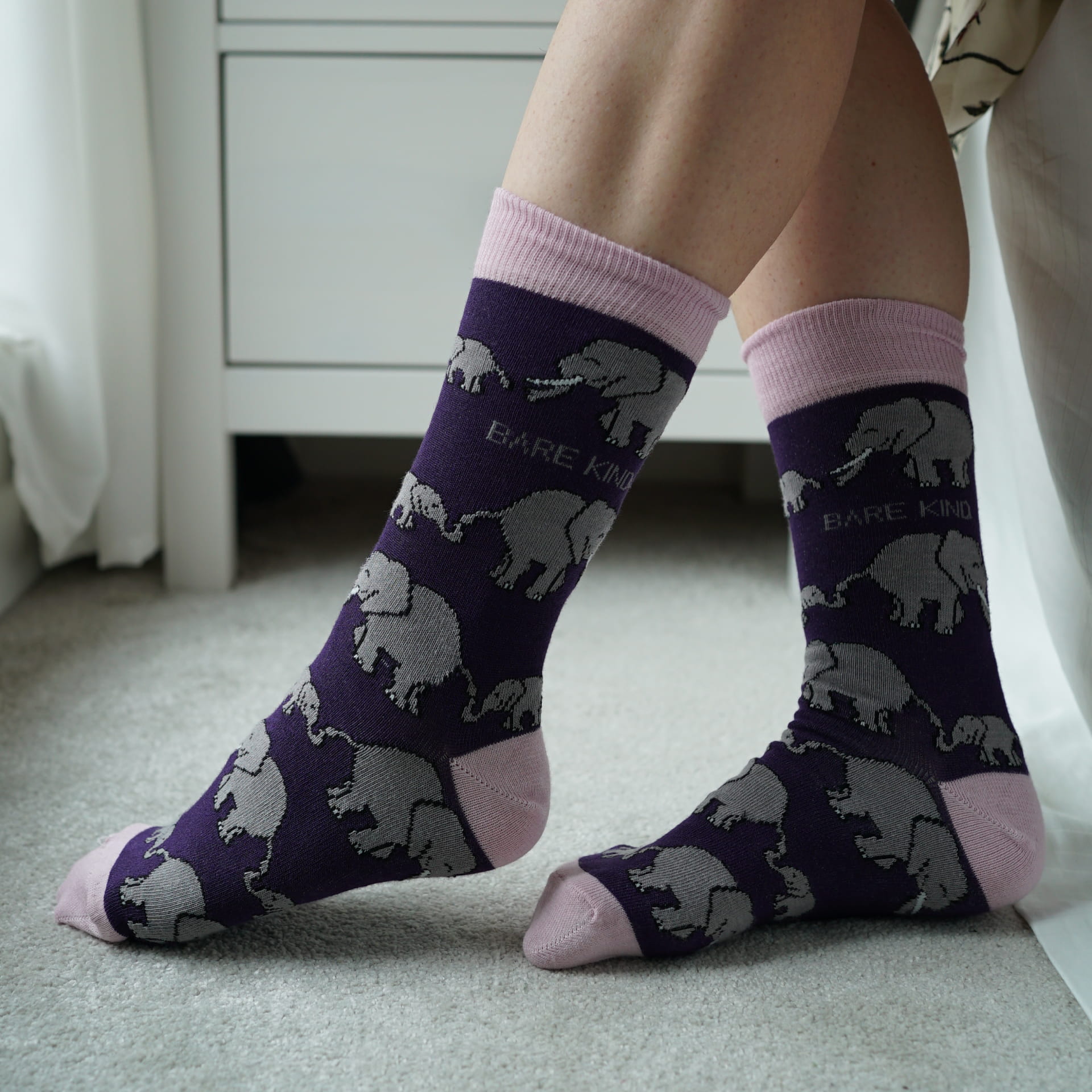 model wearing purple elephant bamboo socks