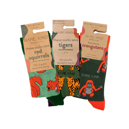 packaging flat lays of green red squirrel, tiger and orangutan bamboo socks