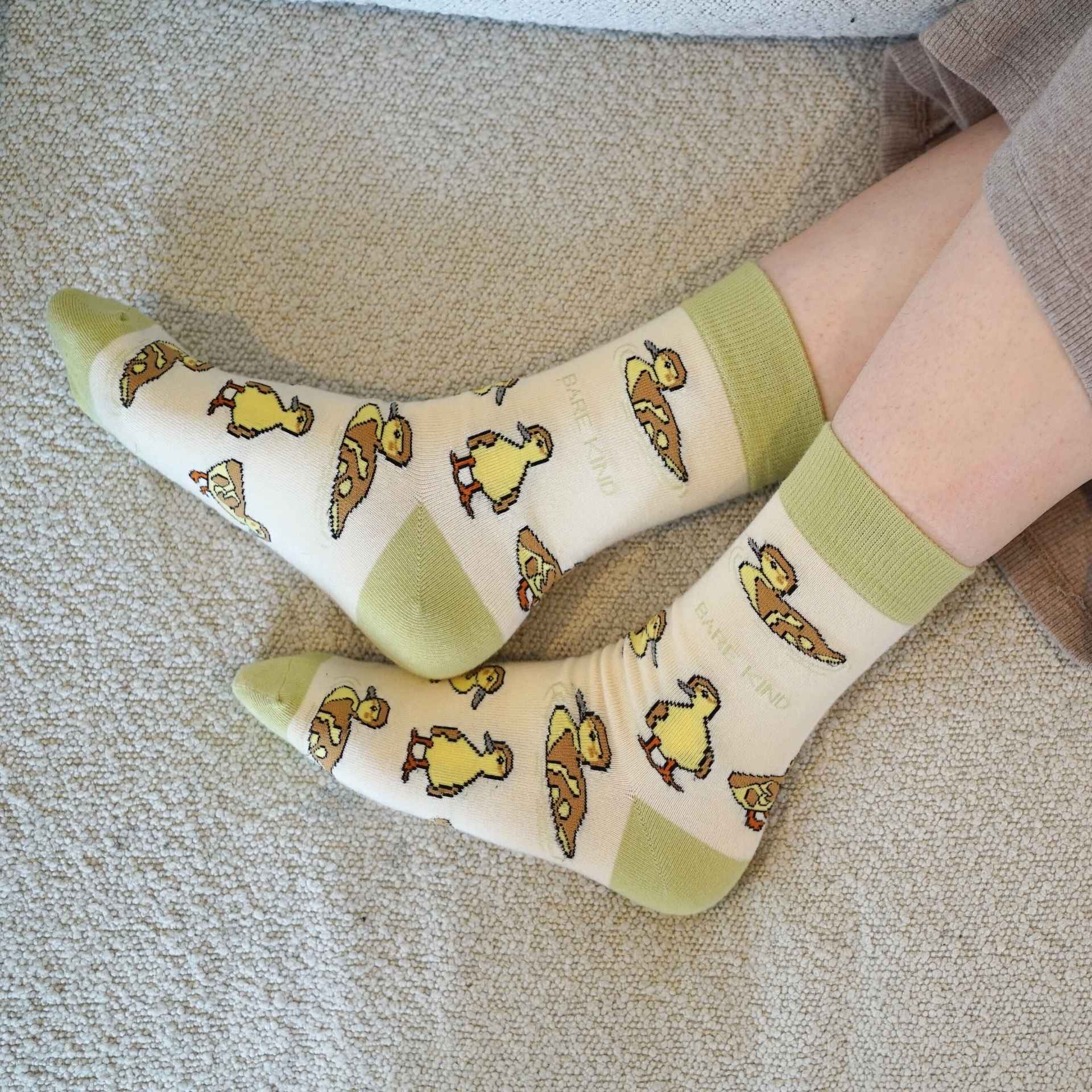model wearing green ducklings bamboo socks