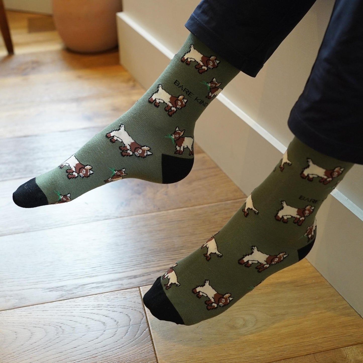 model wearing green goats bamboo socks