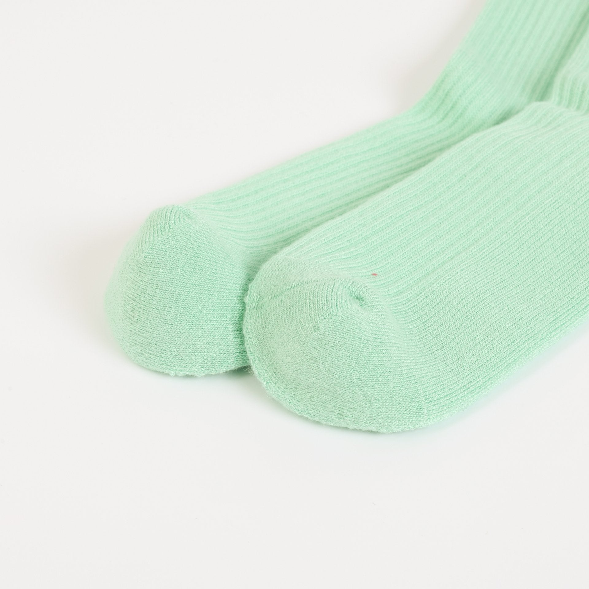 flat lays of green hedgehogs ribbed bamboo socks