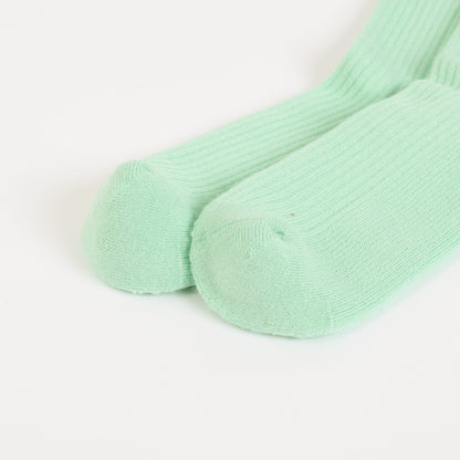 flat lays of green hedgehogs ribbed bamboo socks