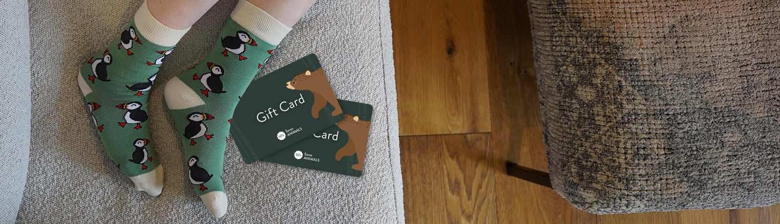 Person wearing green puffins bamboo socks