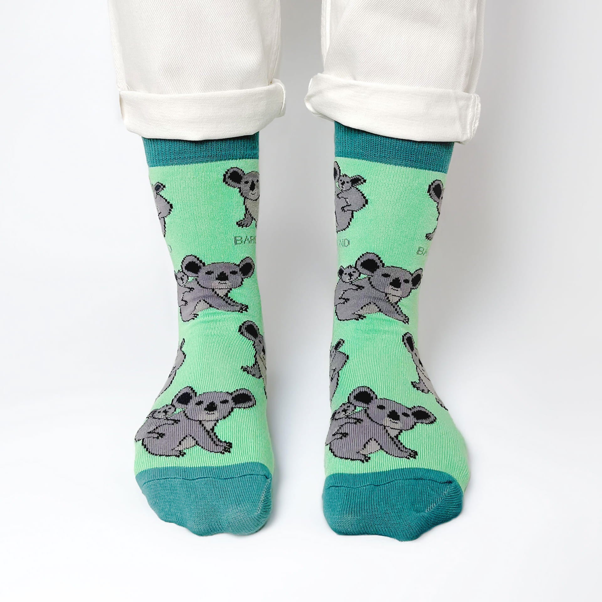 model wearing green koala bamboo socks