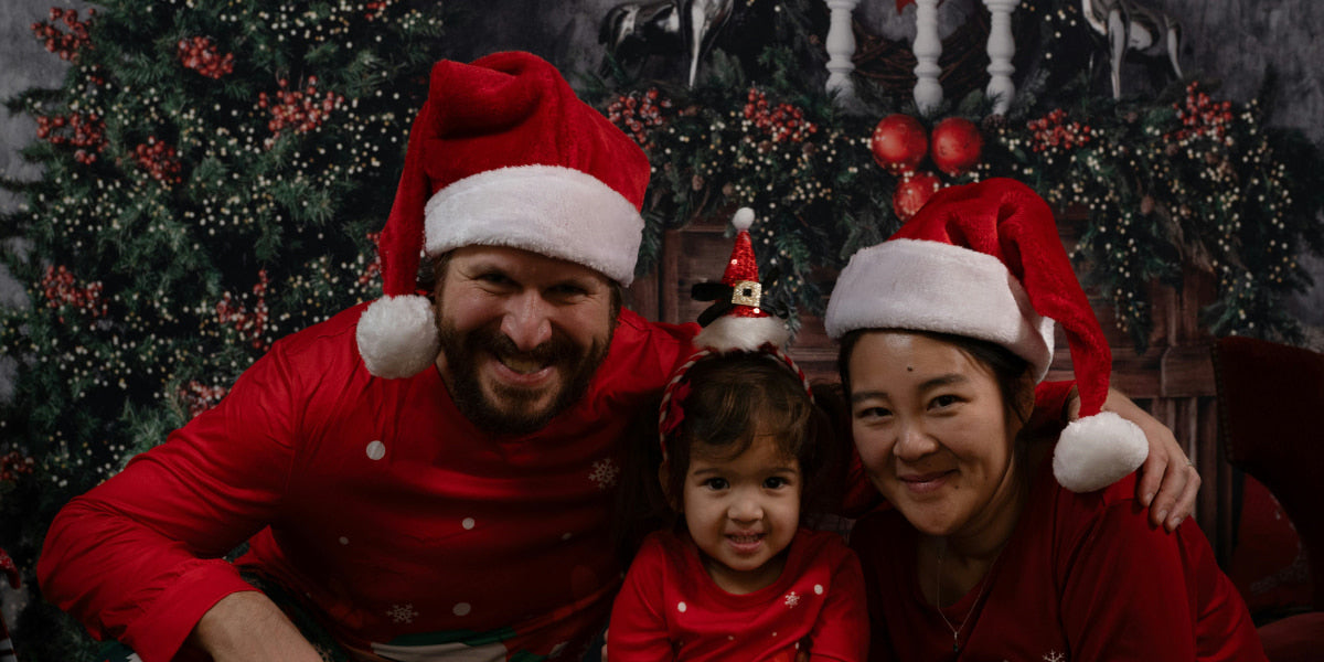 family wearing matching Christmas accessories