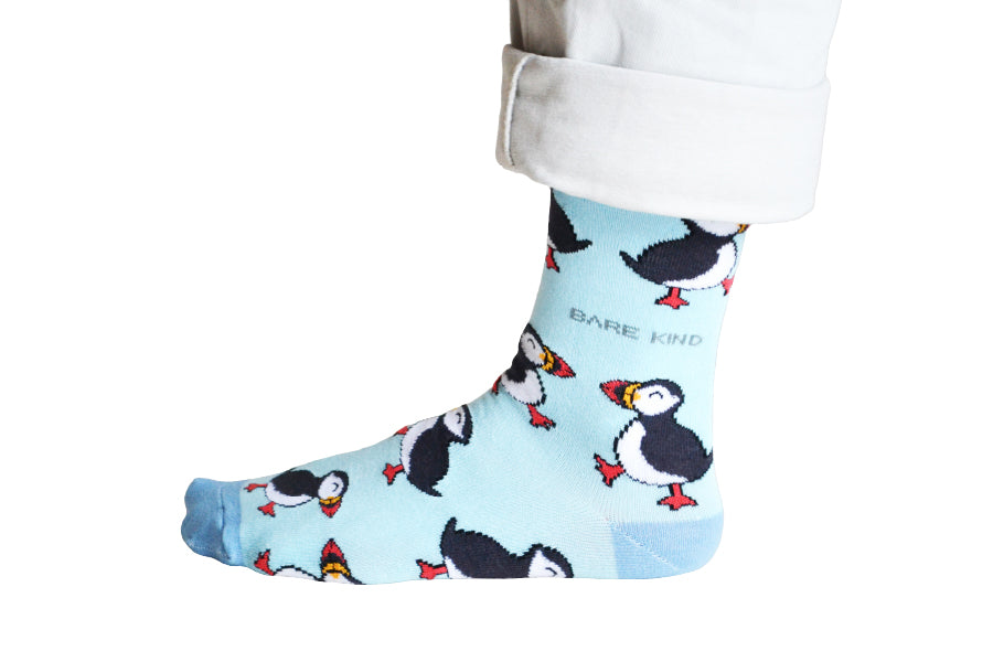 Our great Puffin Blue Socks, with a fun looking Puffin who is smiling and looks like they are walking