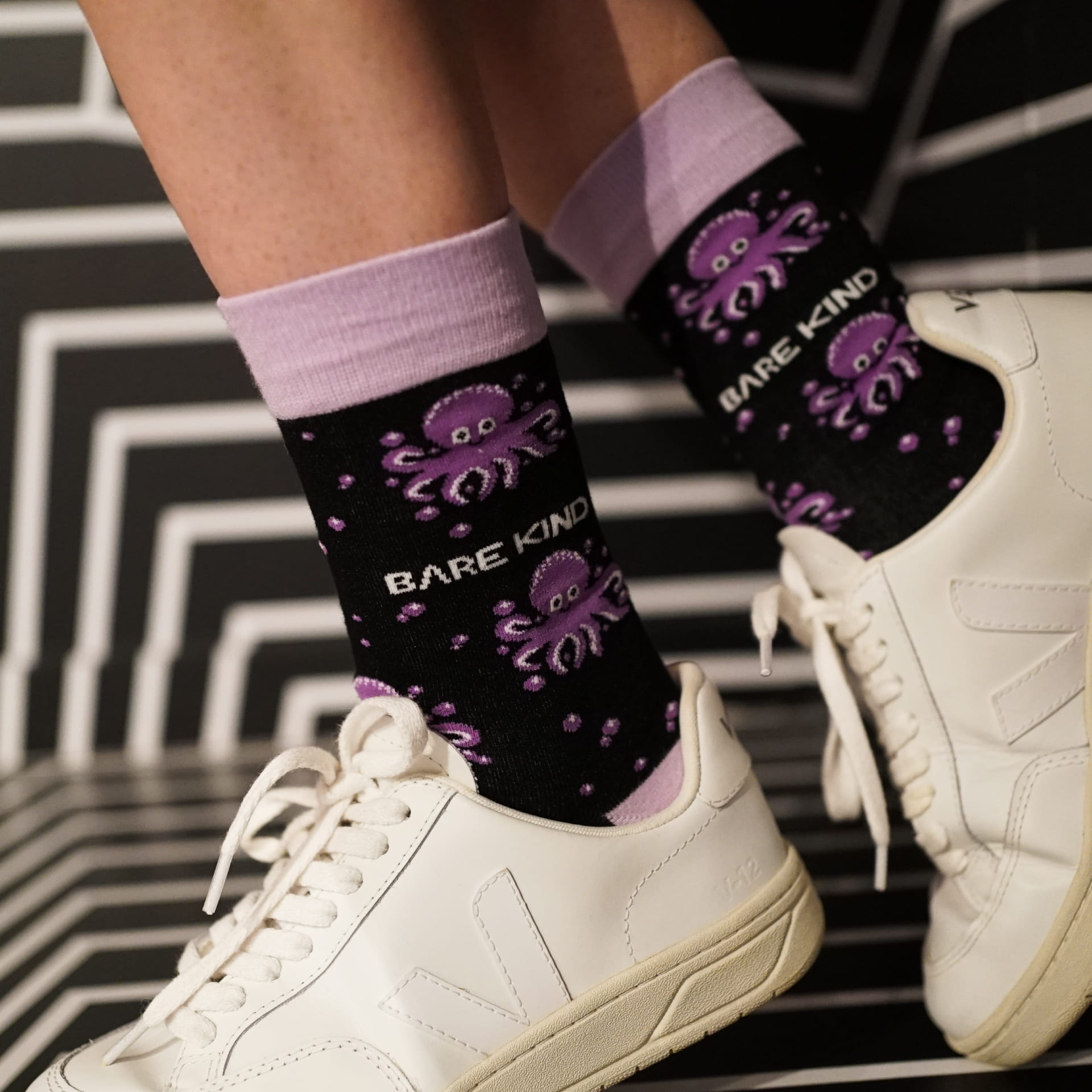 model wearing purple octopus bamboo socks